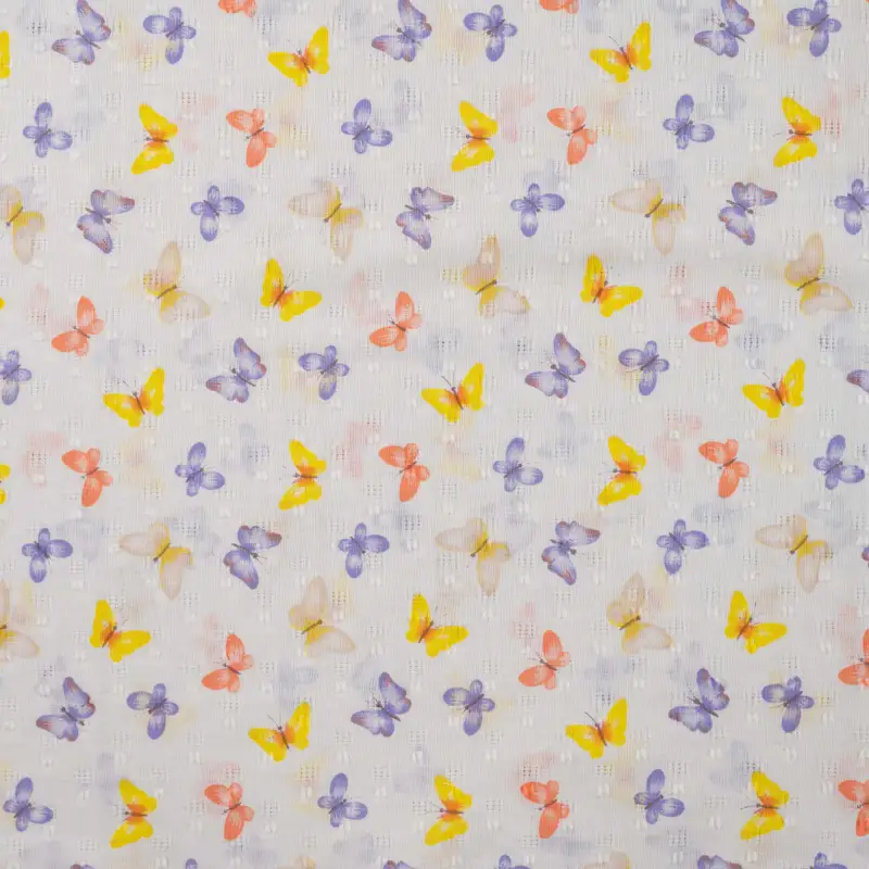 Puuvillane popliin: peen ruudumuster ja värvilised liblikamotiivid.